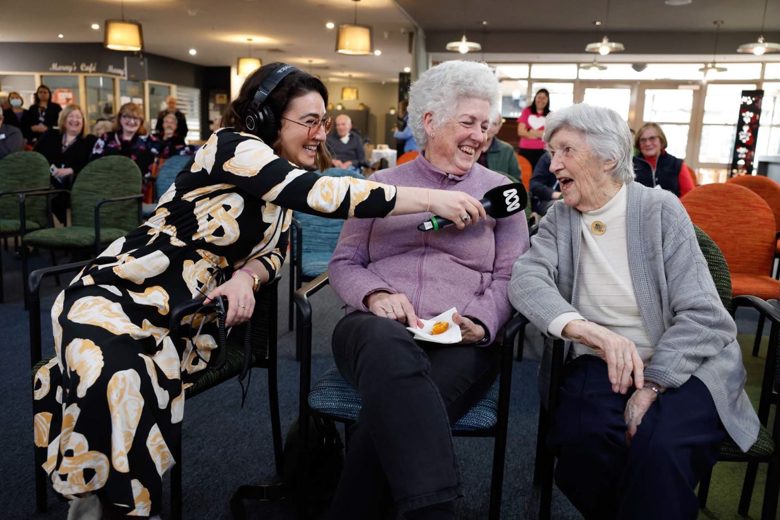 Two residents are being interviewed by a broadcaster