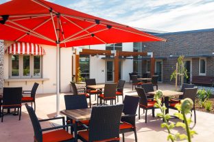 Courtyard with outdoor furniture and plants.